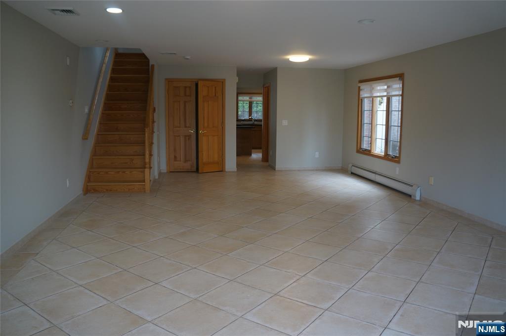 520 7th Street, Unit B Palisades Park, NJ 07650 - Photo 3 of 22 an empty room with windows