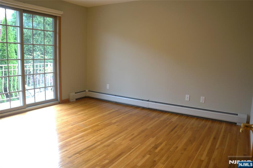 520 7th Street, Unit B Palisades Park, NJ 07650 - Photo 9 of 22 a view of a room with wooden floor and windows