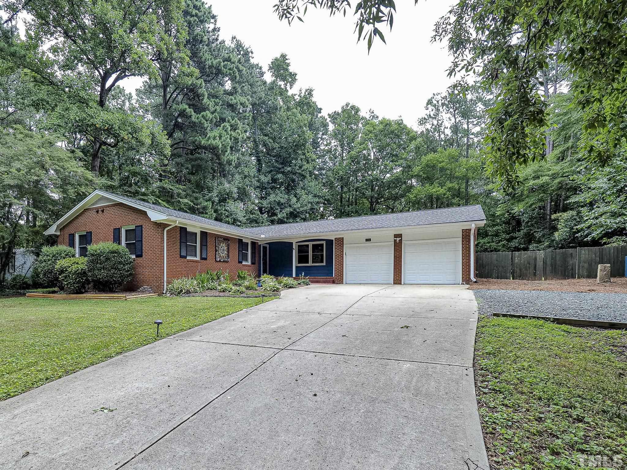 1314 Trinity Circle Raleigh, NC 27607 - Photo 1 of 33 a front view of house with yard and green space