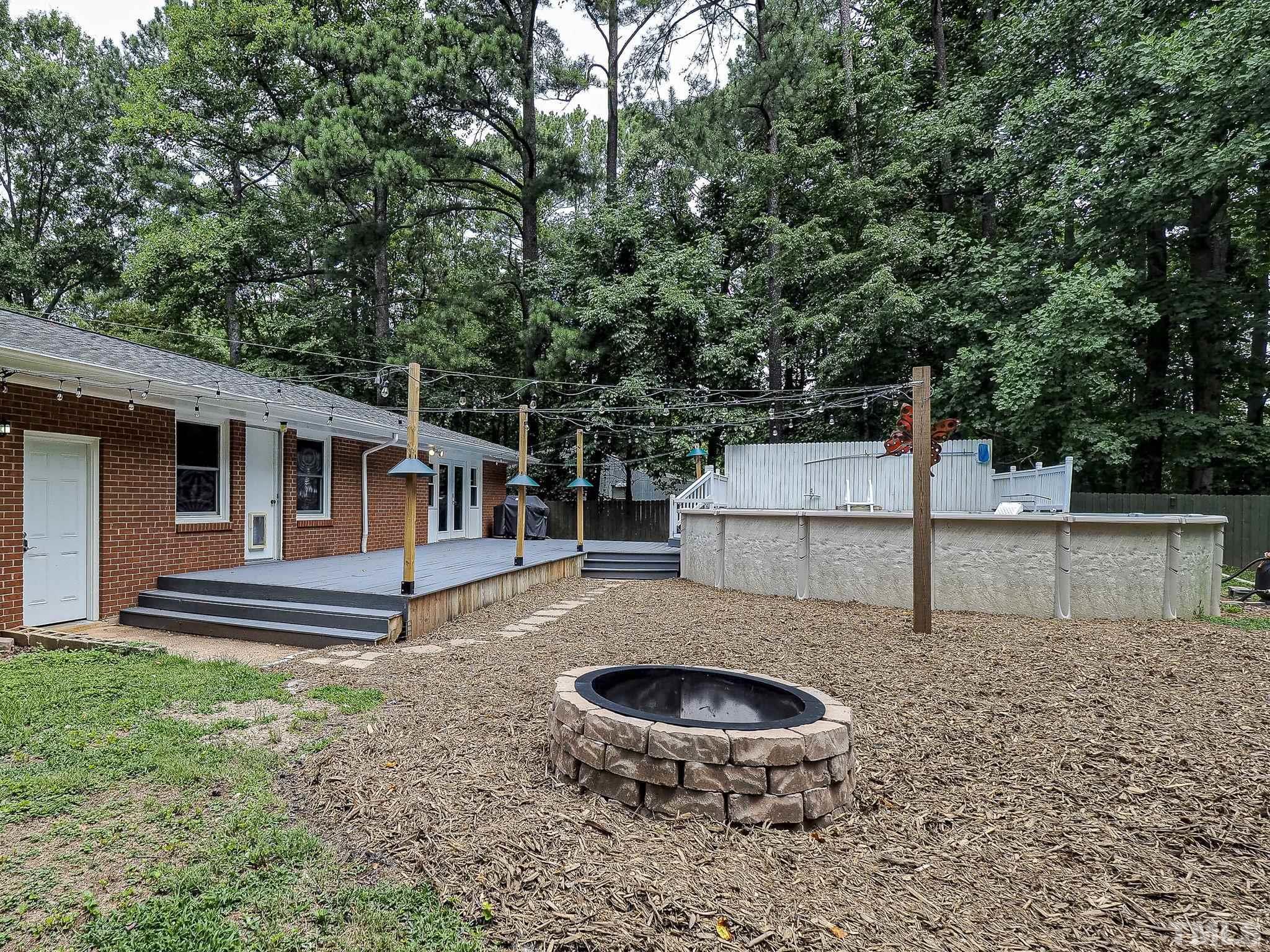 1314 Trinity Circle Raleigh, NC 27607 - Photo 20 of 33 a front view of a house with garden