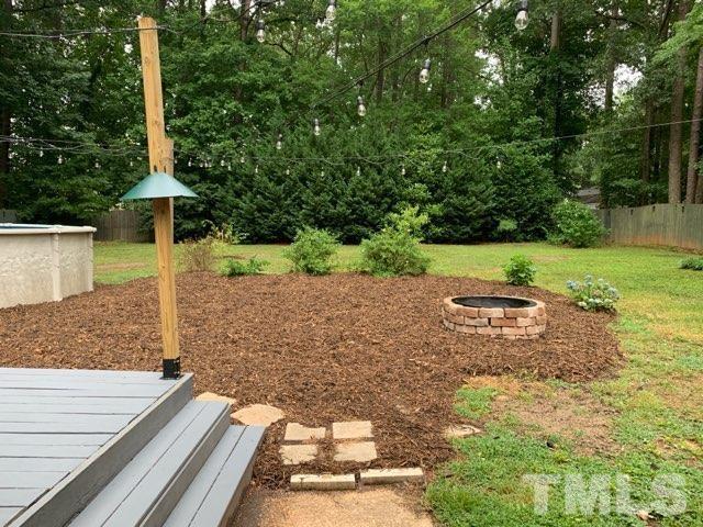 1314 Trinity Circle Raleigh, NC 27607 - Photo 23 of 33 a backyard of a house with lots of green space