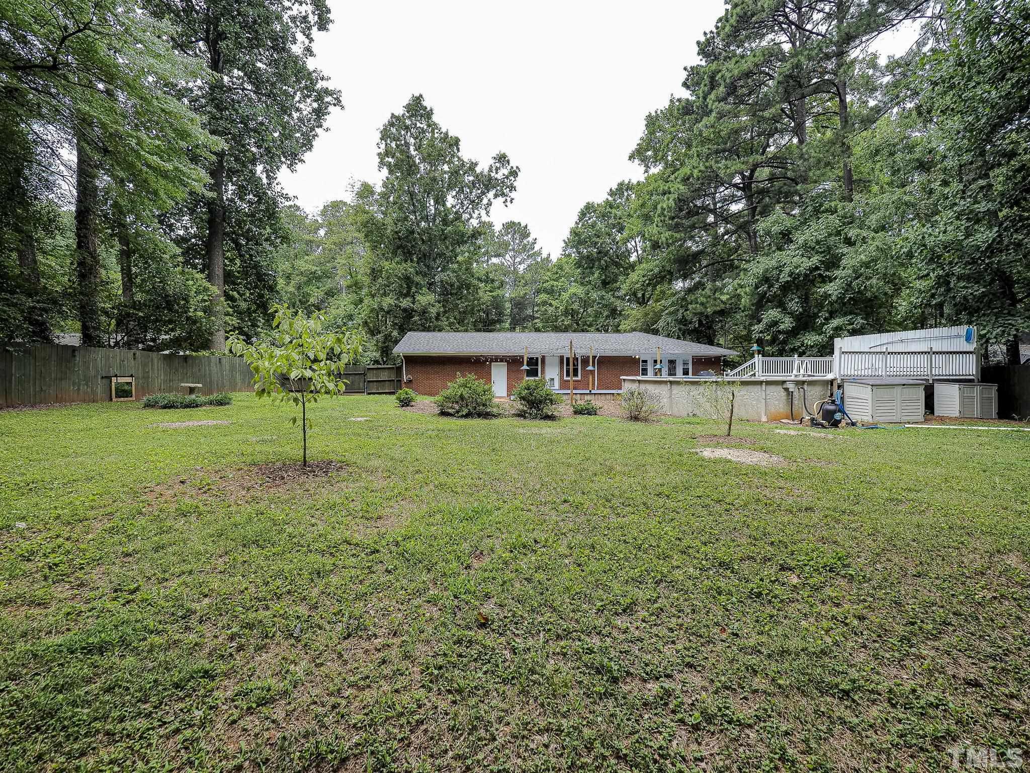 1314 Trinity Circle Raleigh, NC 27607 - Photo 24 of 33 a view of a house with a yard