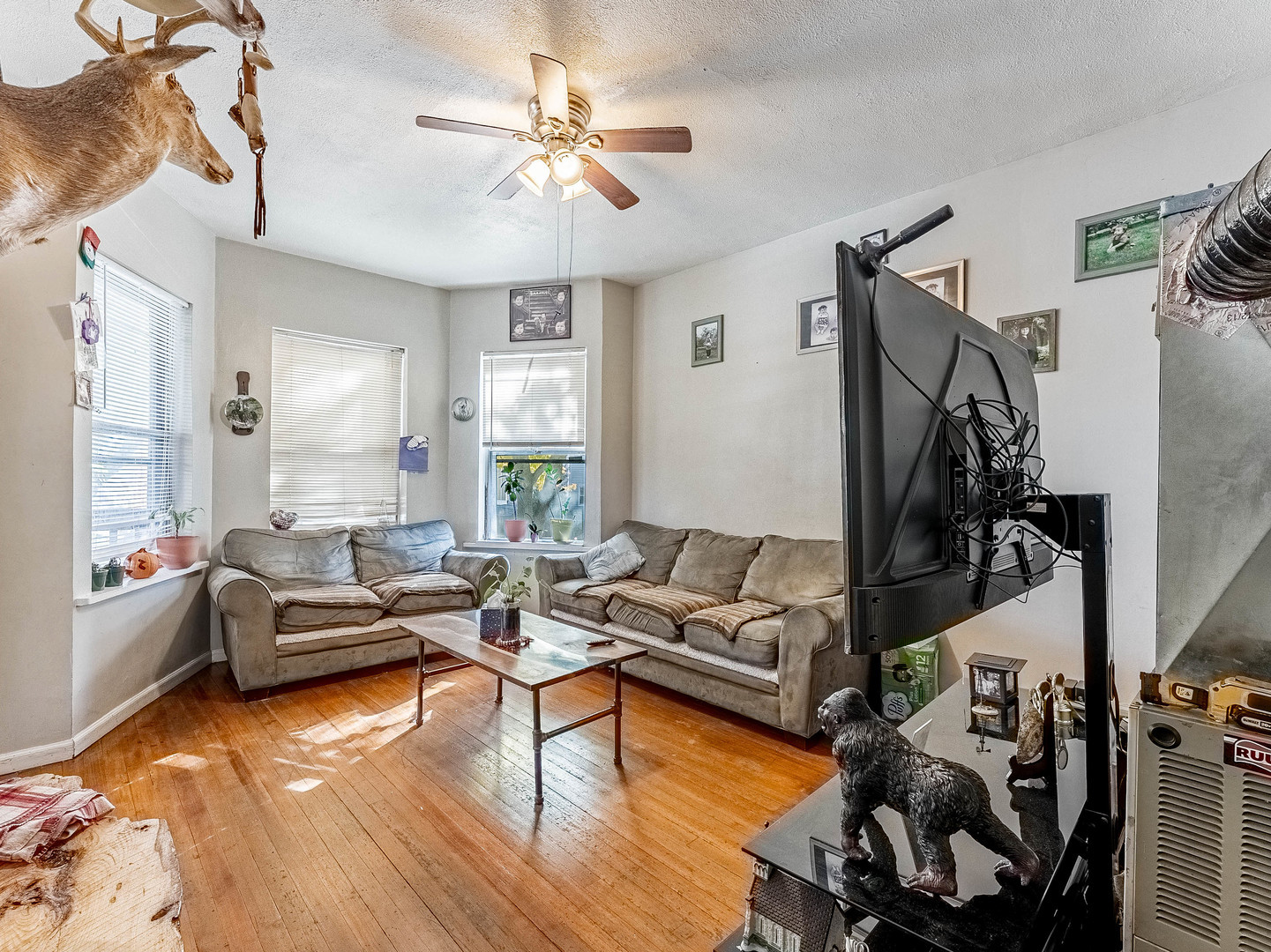 3244 North Drake Avenue Chicago, IL 60618 - Photo 15 of 37 a living room with furniture and a wooden floor