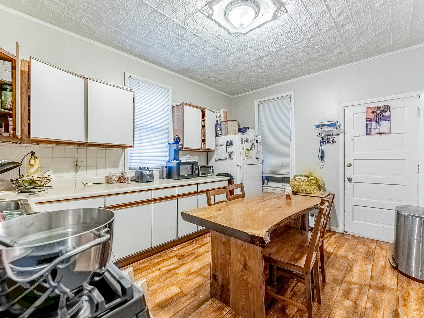 3244 North Drake Avenue Chicago, IL 60618 - Photo 19 of 37 a room with stainless steel appliances kitchen island granite countertop furniture and a sink