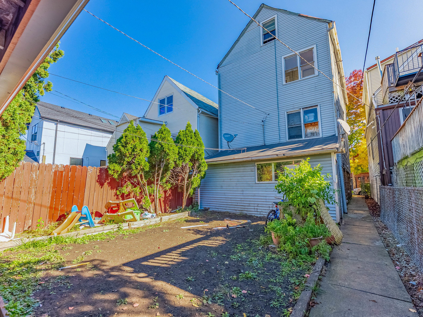 3244 North Drake Avenue Chicago, IL 60618 - Photo 32 of 37 a view of a street with potted plants
