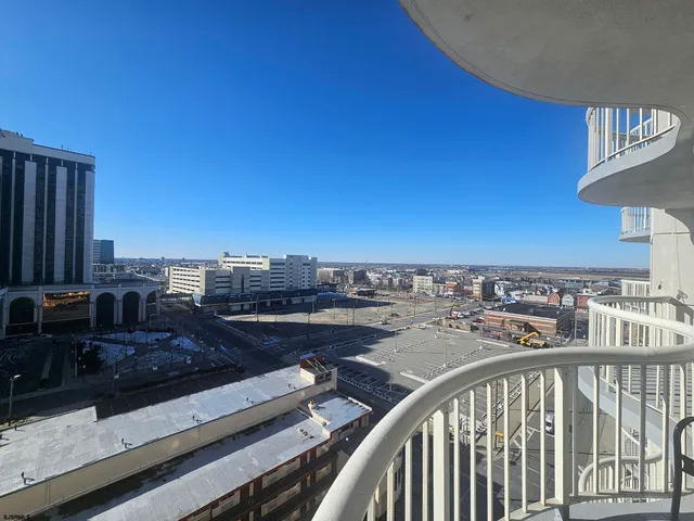a utility room with wooden floor washer and dryer
