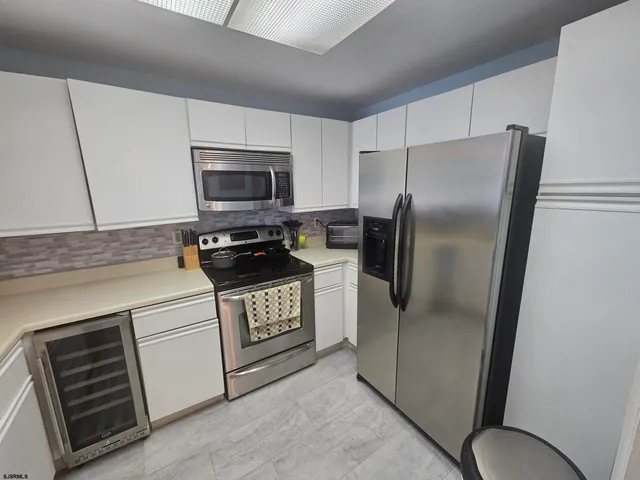 a view of a room wooden floor and fire place