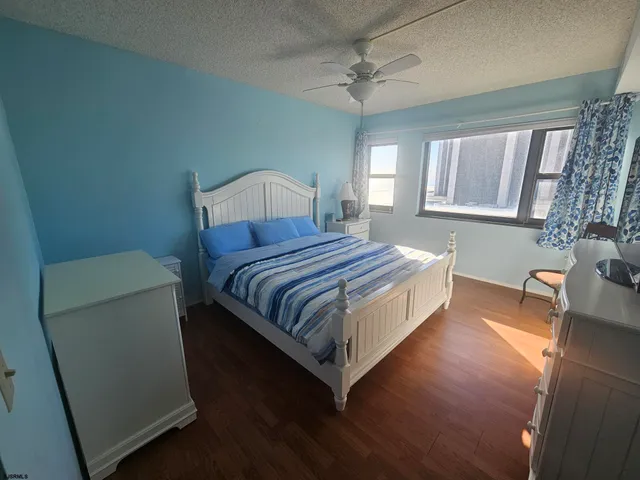 a bathroom with a sink and mirror with toilet