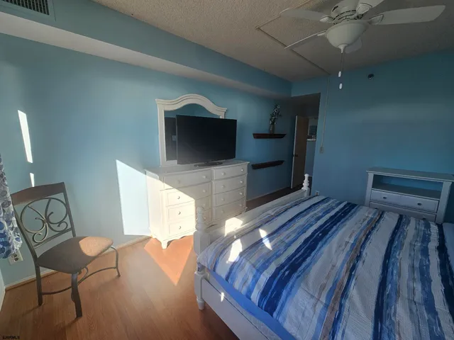 a view of a chairs and table in the balcony