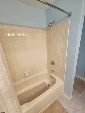 a view of a swimming pool with sitting area