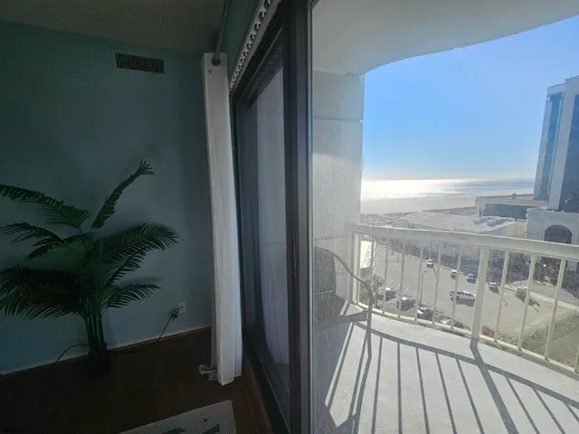a view of a balcony with wooden floor