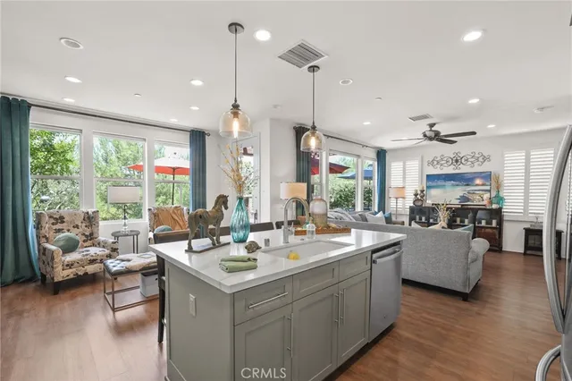 a view of living room with furniture and floor to ceiling windows