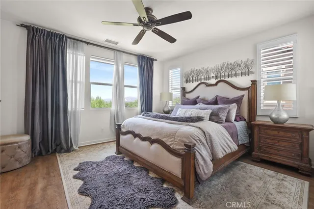 a bedroom with a large bed and a window