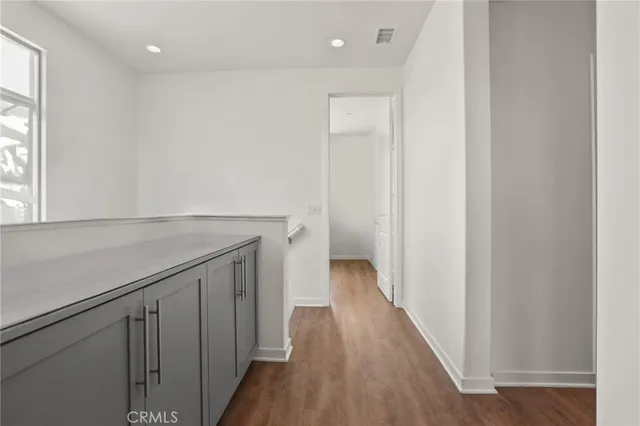 a view of hallway with wooden floor