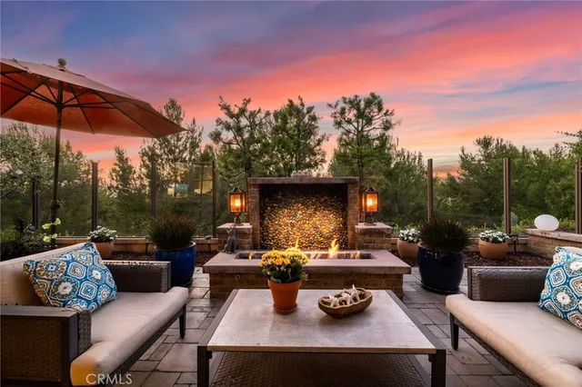 a outdoor living space with furniture and a fireplace