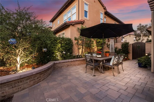 an outdoor space with furniture and umbrella