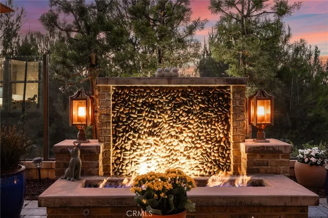 a view of a balcony chairs and iron fence
