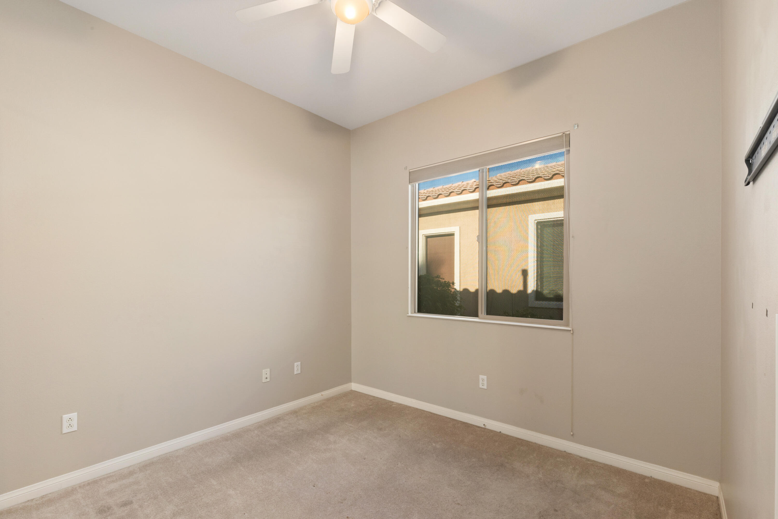 81935 Avenida Bienvenida Indio, CA 92203 - Photo 13 of 35 an empty room with a window