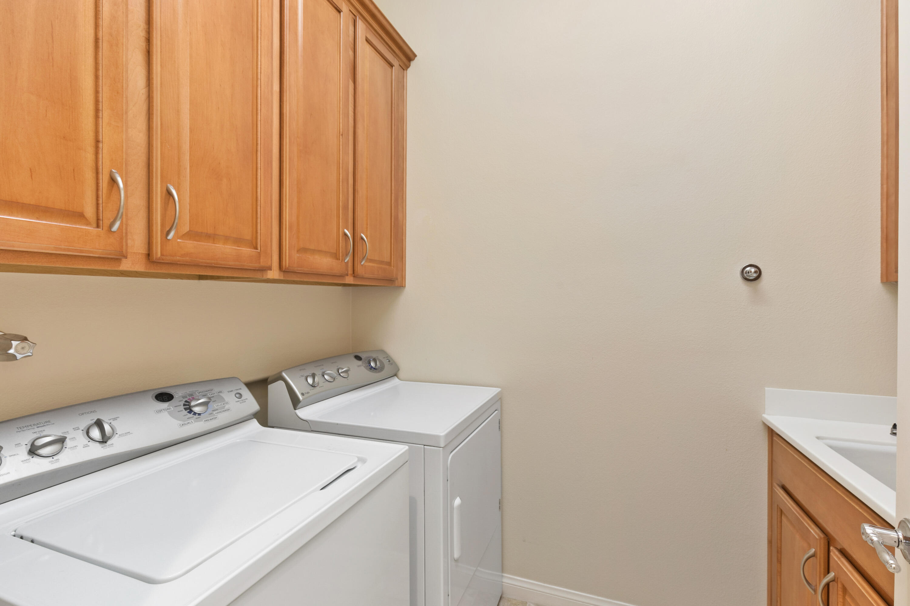 81935 Avenida Bienvenida Indio, CA 92203 - Photo 16 of 35 a utility room with dryer and washer