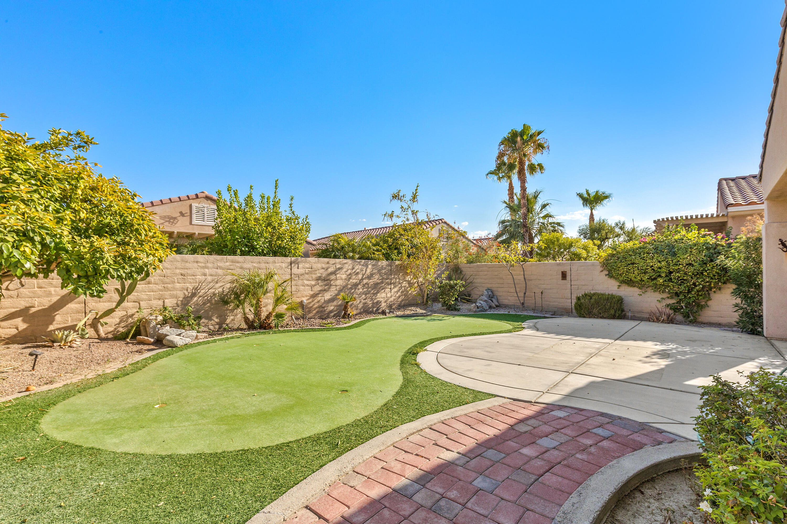 81935 Avenida Bienvenida Indio, CA 92203 - Photo 17 of 35 a view of a swimming pool with a yard