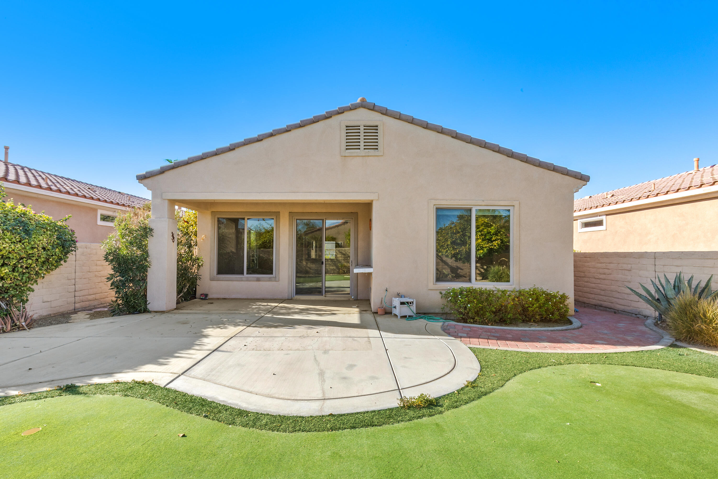 81935 Avenida Bienvenida Indio, CA 92203 - Photo 18 of 35 a front view of a house with garden