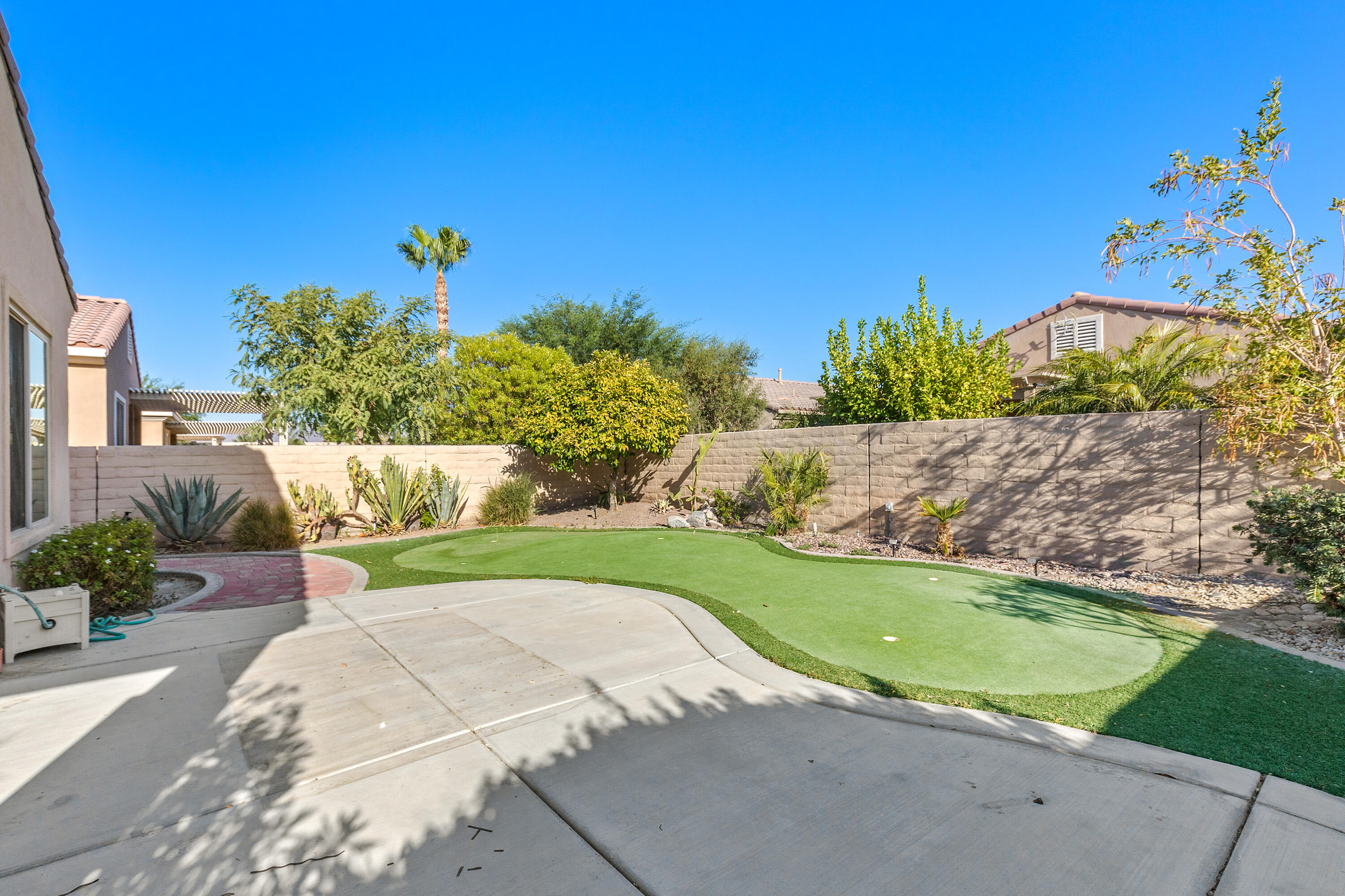 81935 Avenida Bienvenida Indio, CA 92203 - Photo 19 of 35 a view of a backyard with a garden and plants