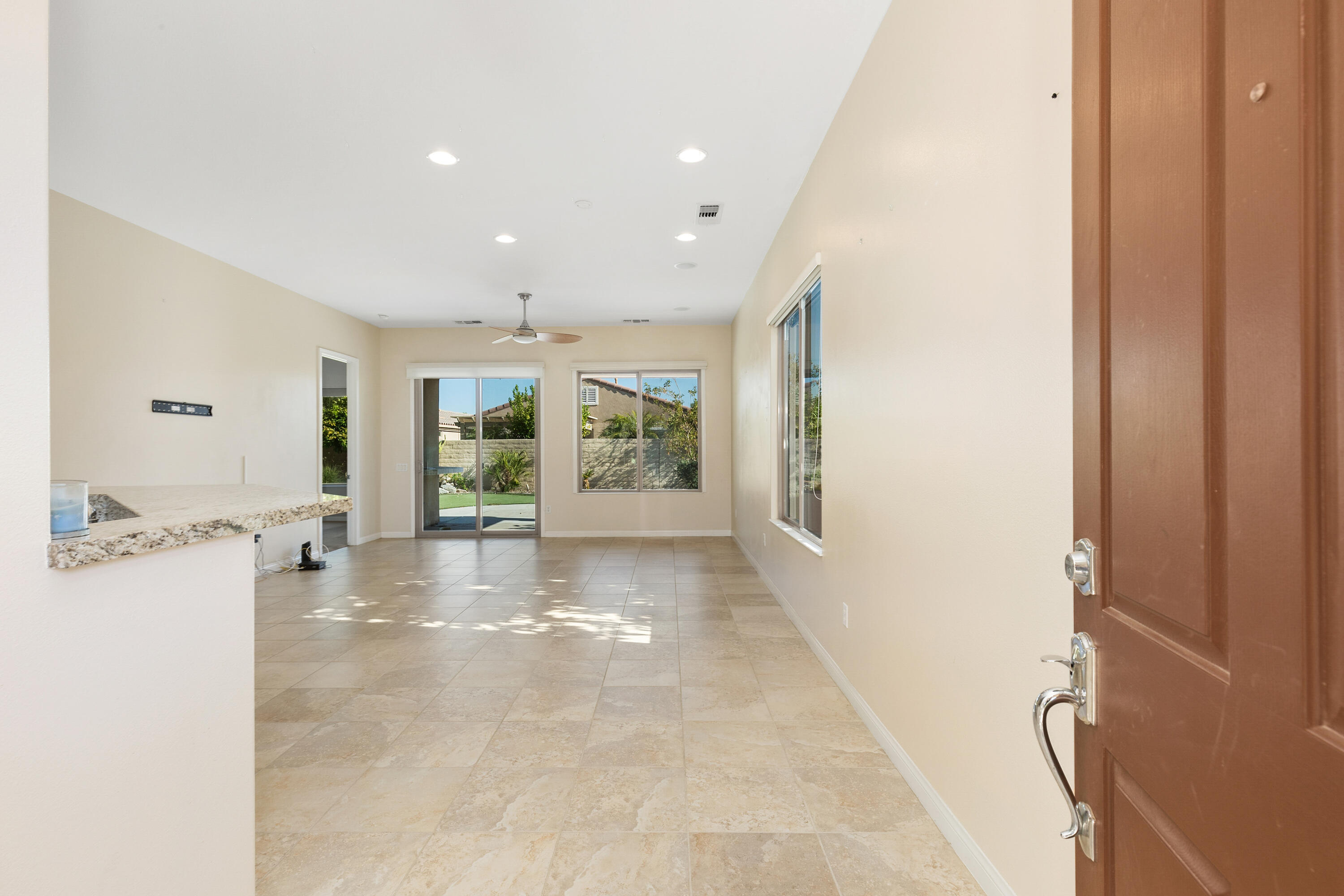 81935 Avenida Bienvenida Indio, CA 92203 - Photo 2 of 35 a view of a hallway with staircase and windows