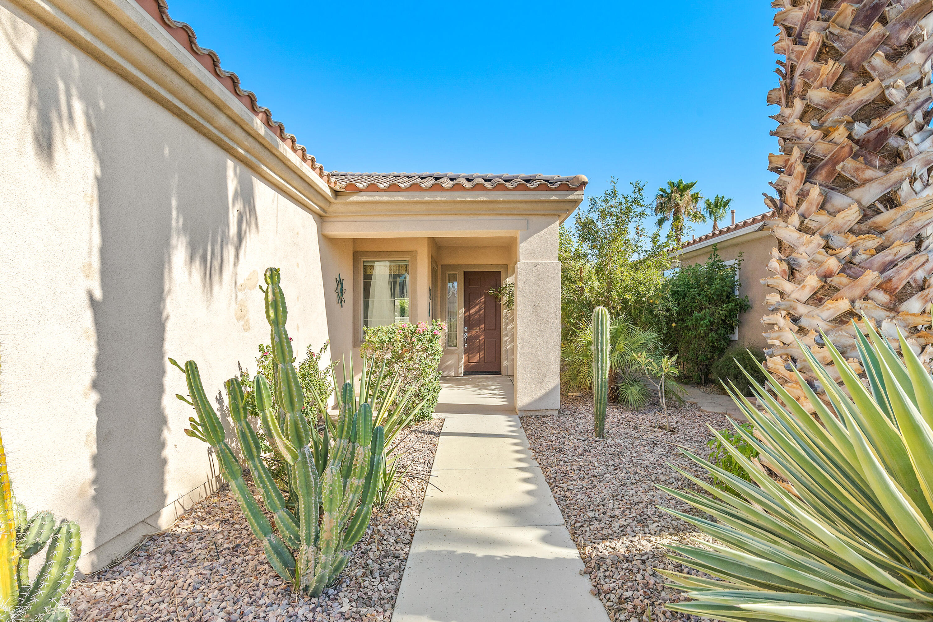 81935 Avenida Bienvenida Indio, CA 92203 - Photo 23 of 35 a view of a entryway door of the house