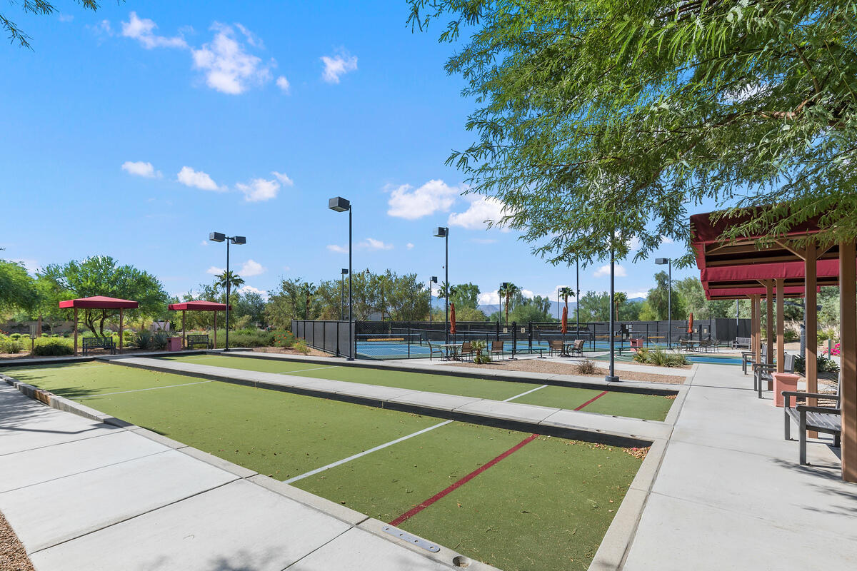81935 Avenida Bienvenida Indio, CA 92203 - Photo 32 of 35 a view of a swimming pool with an outdoor seating and a garden