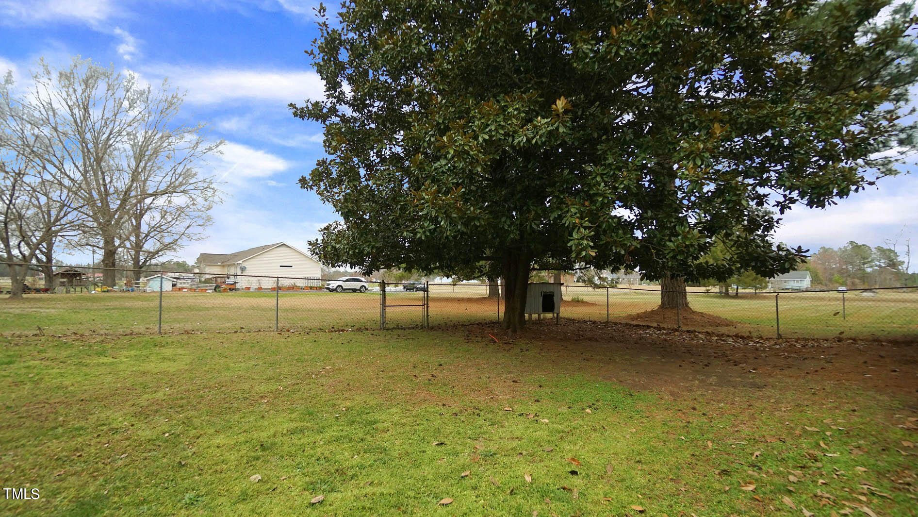 2871 Pilot-Riley Road Zebulon, NC 27597 - Photo 29 of 32 a view of a yard with a tree