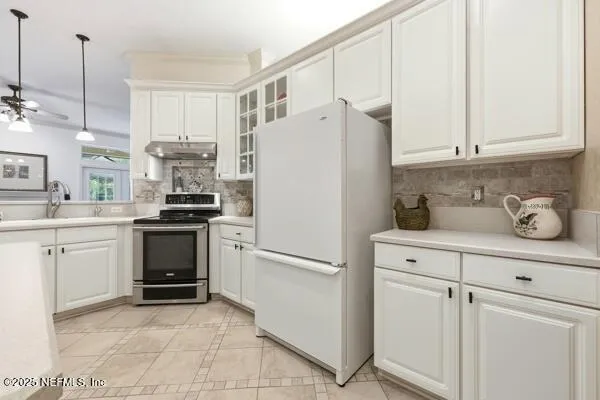 a white refrigerator freezer sitting in a kitchen
