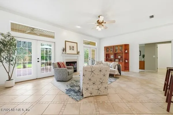 a living room with furniture potted plant and a fireplace