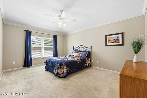 11381 Mandarin Ridge Lane Jacksonville, FL 32258 - Photo 22 of 43 a spacious bedroom with a bed and a window