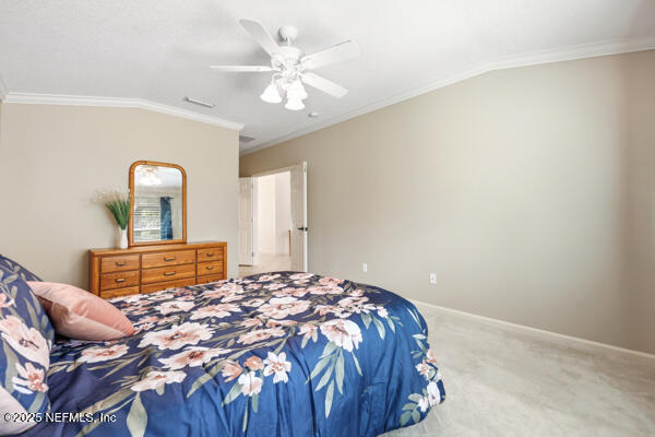 11381 Mandarin Ridge Lane Jacksonville, FL 32258 - Photo 23 of 43 a bedroom with a bed and a chandelier