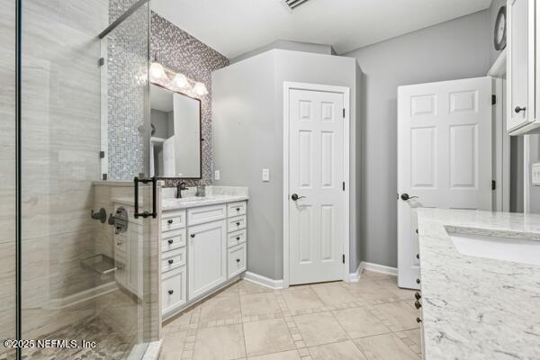 11381 Mandarin Ridge Lane Jacksonville, FL 32258 - Photo 27 of 43 a bathroom with a granite countertop sink mirror and shower