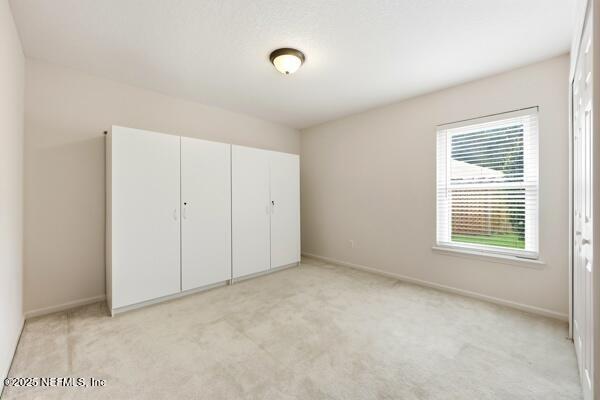 11381 Mandarin Ridge Lane Jacksonville, FL 32258 - Photo 29 of 43 a view of an empty room with a window