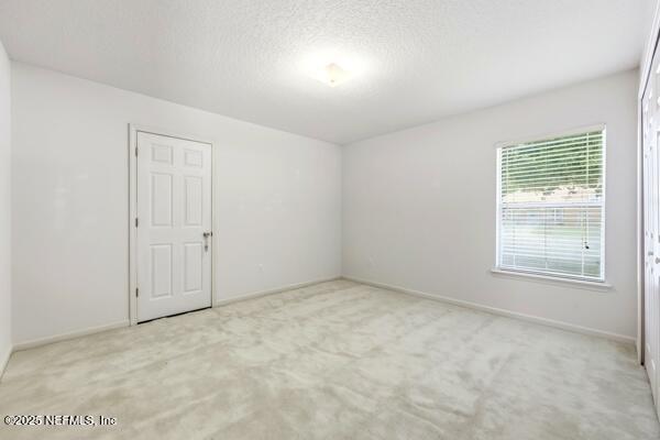 11381 Mandarin Ridge Lane Jacksonville, FL 32258 - Photo 33 of 43 an empty room with a empty space and windows