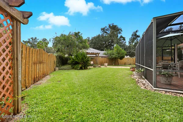 a view of a backyard with pathway