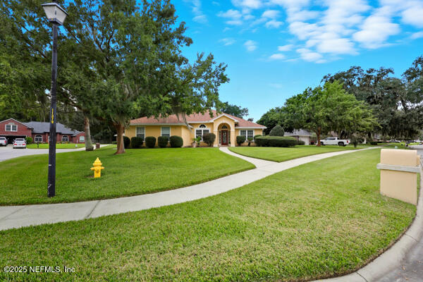 11381 Mandarin Ridge Lane Jacksonville, FL 32258 - Photo 41 of 43 a view of a house with a backyard porch and sitting area