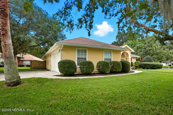 11381 Mandarin Ridge Lane Jacksonville, FL 32258 - Photo 42 of 43 a view of a house with a yard