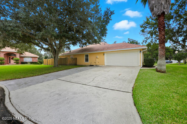 11381 Mandarin Ridge Lane Jacksonville, FL 32258 - Photo 43 of 43 a view of backyard of house with green space