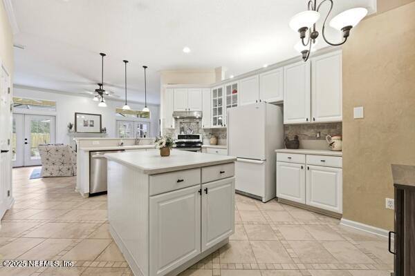 11381 Mandarin Ridge Lane Jacksonville, FL 32258 - Photo 9 of 43 a kitchen with white cabinets and refrigerator