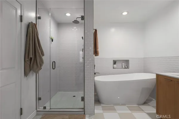 a bathroom with a bathtub and a shower