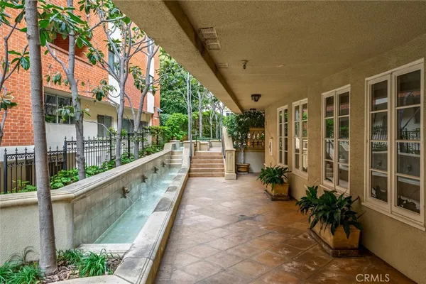a view of balcony with potted plants
