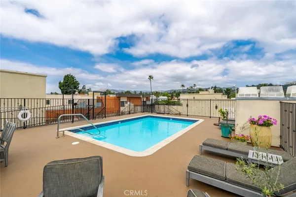 swimming pool with outdoor seating