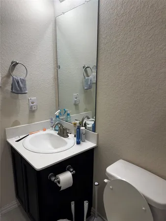 a utility room with sink and vanity