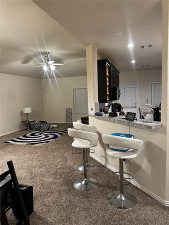 a kitchen with a sink and a refrigerator