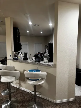 a room with lots of chairs and mirrors