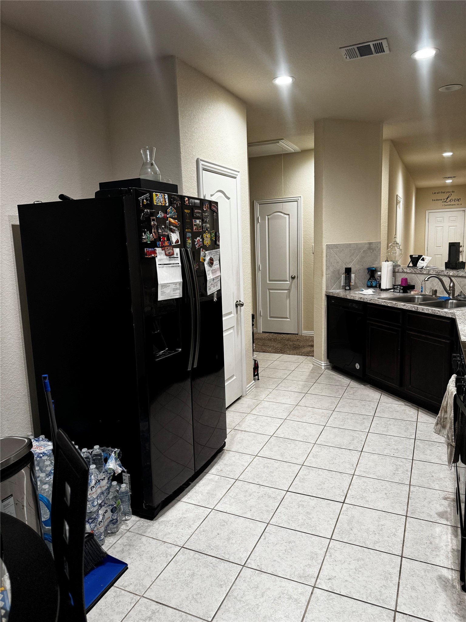 22739 Highland Maple Court Spring, TX 77373 - Photo 31 of 48 a kitchen with granite countertop a refrigerator and a stove top oven