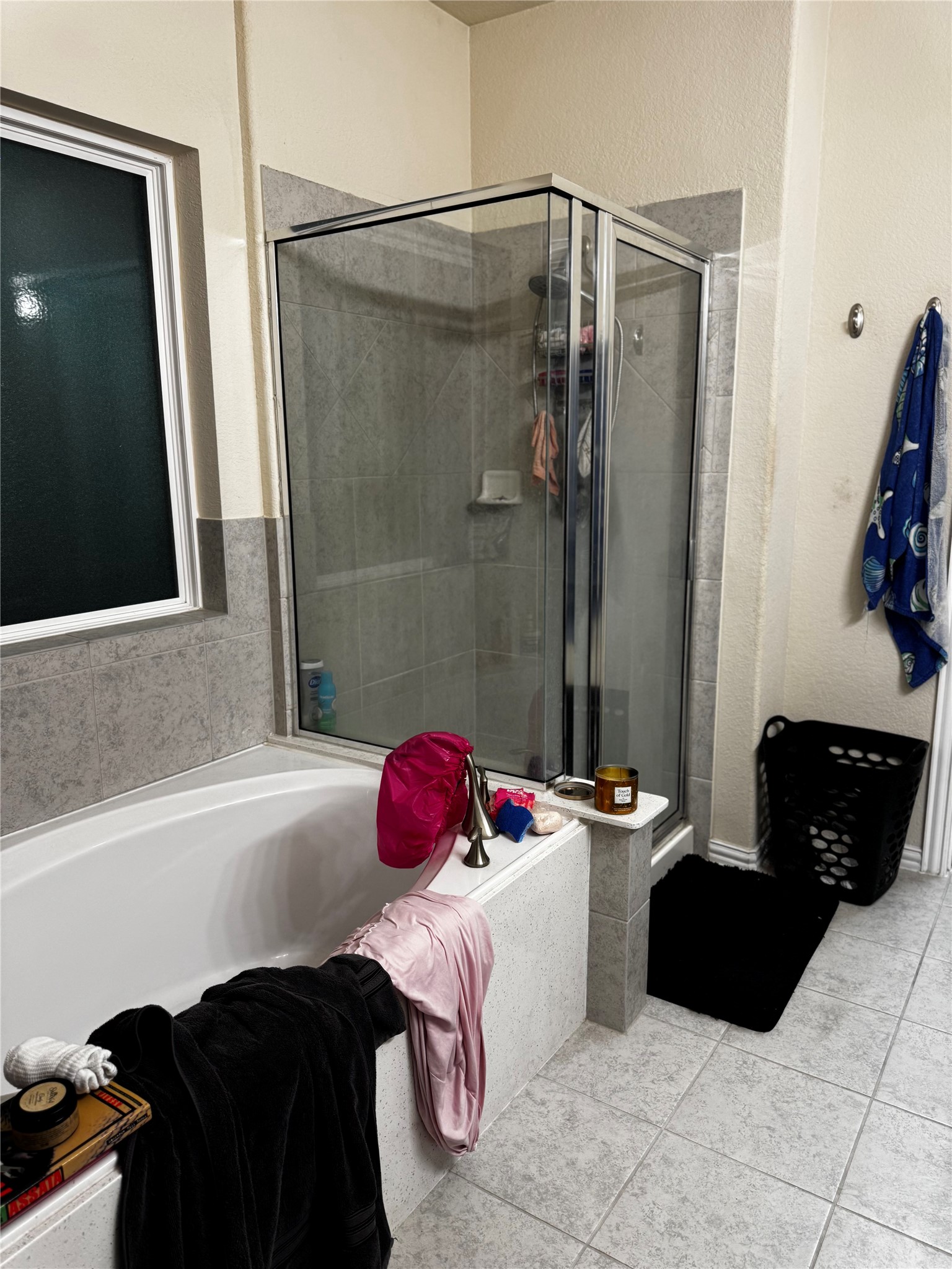 22739 Highland Maple Court Spring, TX 77373 - Photo 37 of 48 a bathroom with a bathtub and a shower